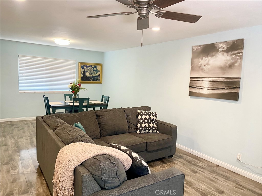 1450 West 146th Street, Unit 2 Gardena, CA 90247 - Photo 10 of 33 a living room with furniture and a ceiling fan