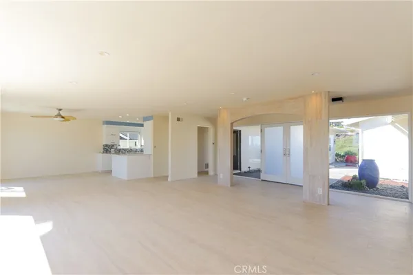 a kitchen with stainless steel appliances granite countertop a sink a stove a refrigerator and a microwave