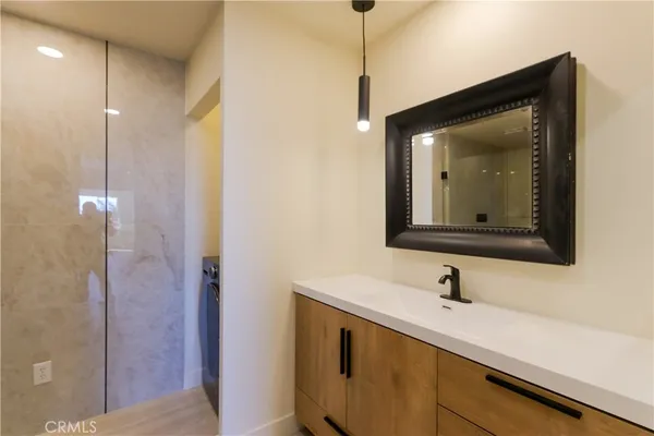 a bathroom with a sink and a mirror