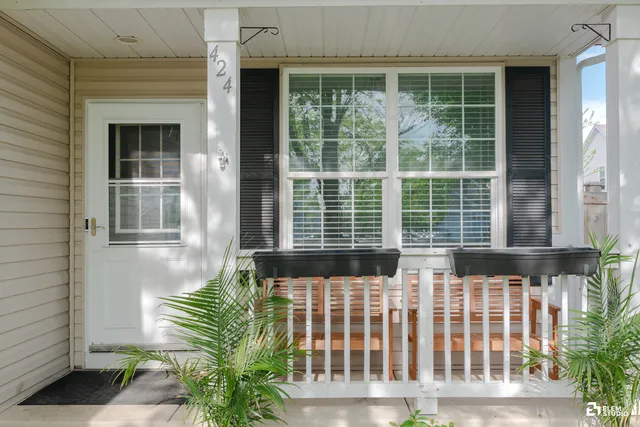 a view of porch with a chairs in a porch