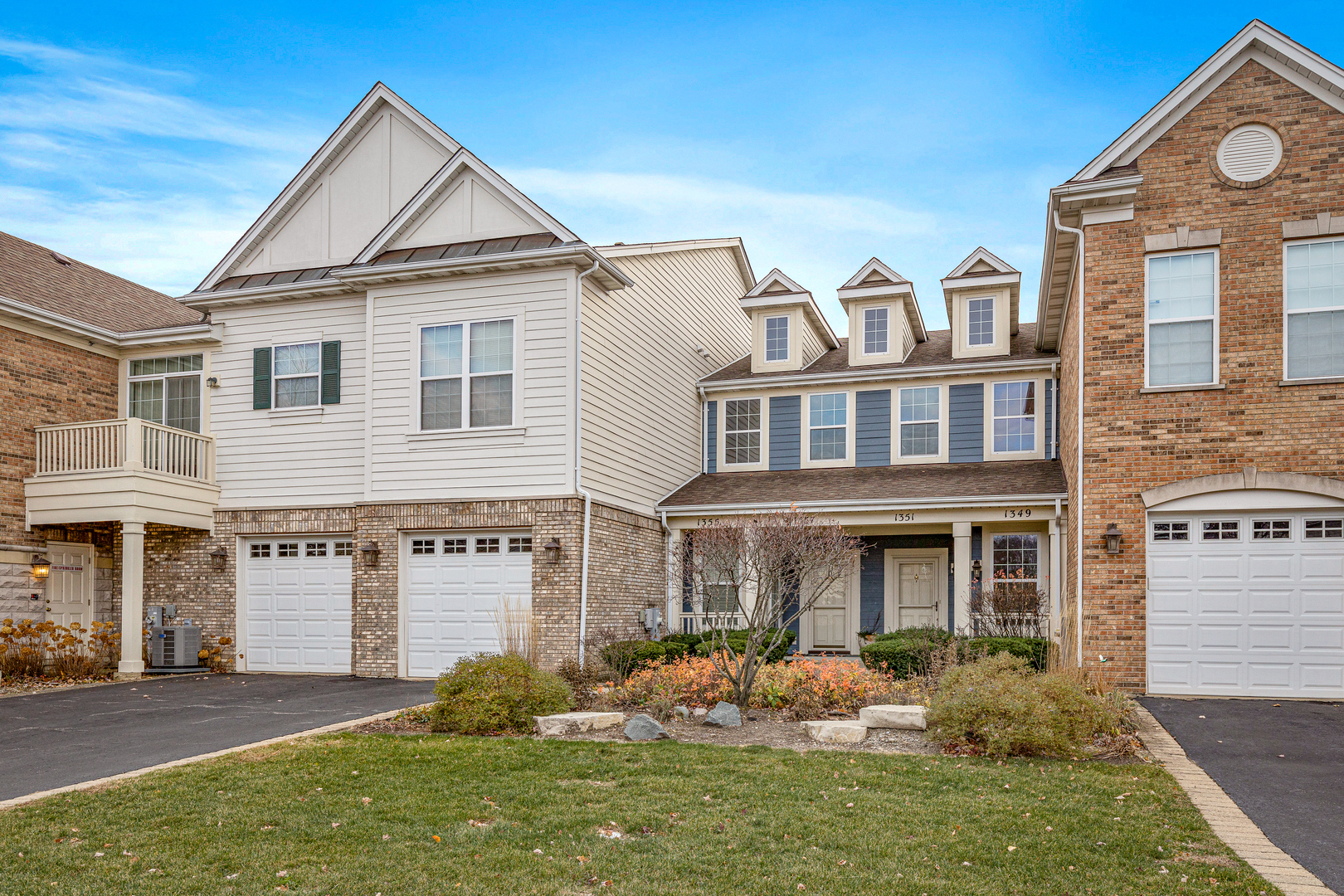 1355 Scarboro Road, Unit 501 Schaumburg, IL 60193 - Photo 1 of 1 a front view of a house with garden