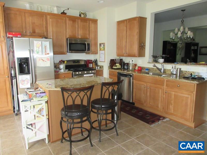 912 Rainier Road Charlottesville, VA 22903 - Photo 3 of 15 a kitchen with a sink cabinets and microwave