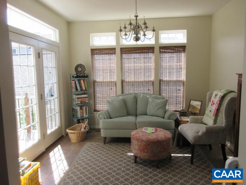 912 Rainier Road Charlottesville, VA 22903 - Photo 4 of 15 a living room with furniture and a chandelier