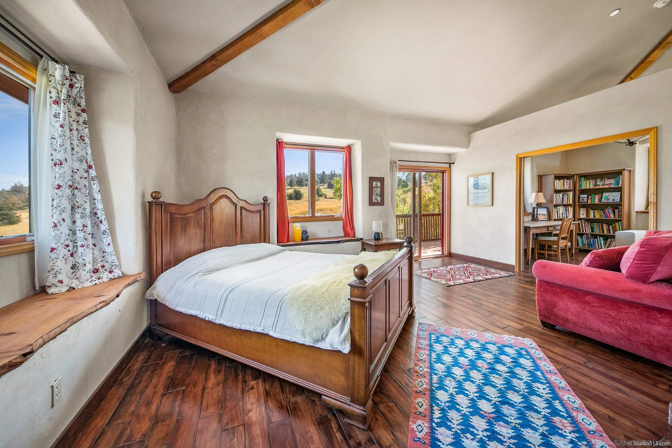 1861 Wynola Road Julian, CA 92036 - Photo 26 of 75 a spacious bedroom with a bed couch and a window