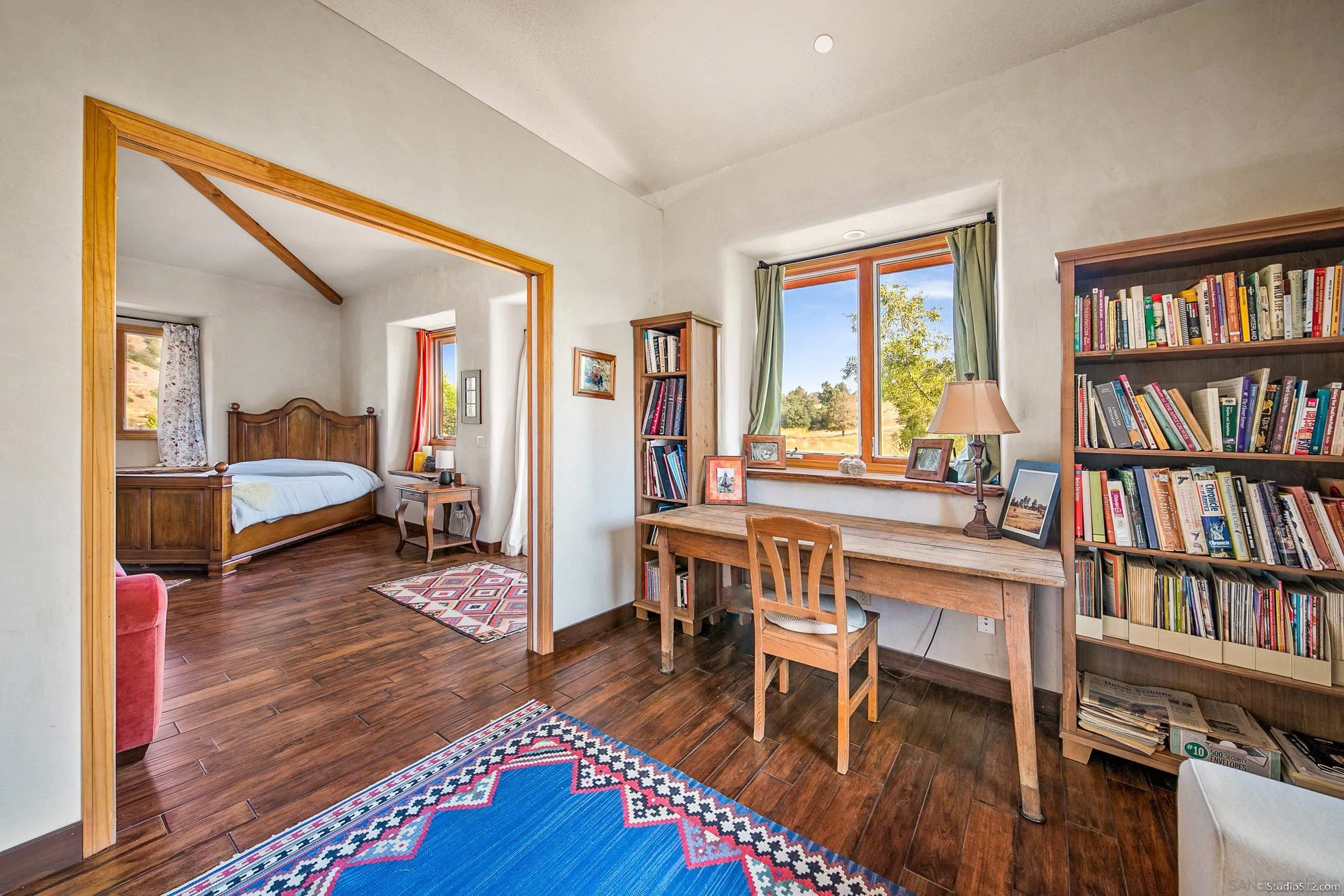 1861 Wynola Road Julian, CA 92036 - Photo 27 of 75 a view of a livingroom with furniture and a bookshelf