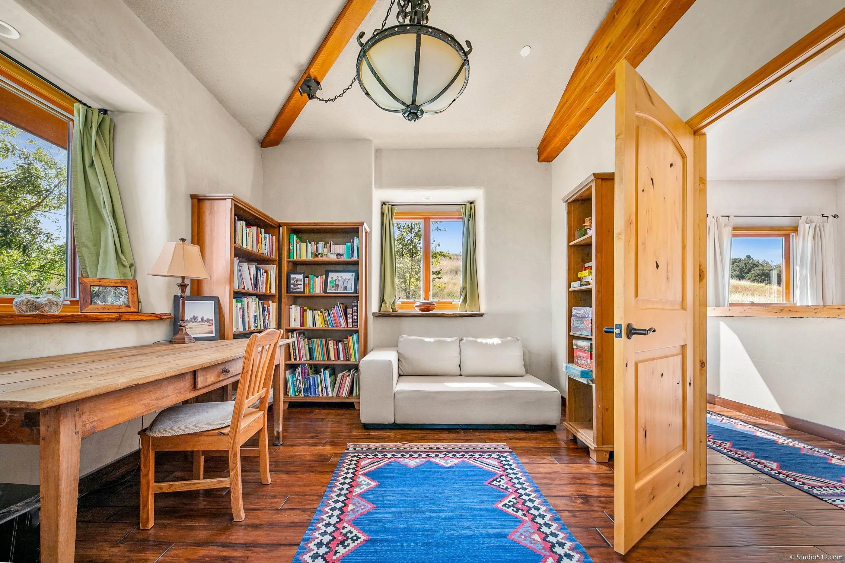 1861 Wynola Road Julian, CA 92036 - Photo 29 of 75 a living room with fireplace furniture and a wooden floor