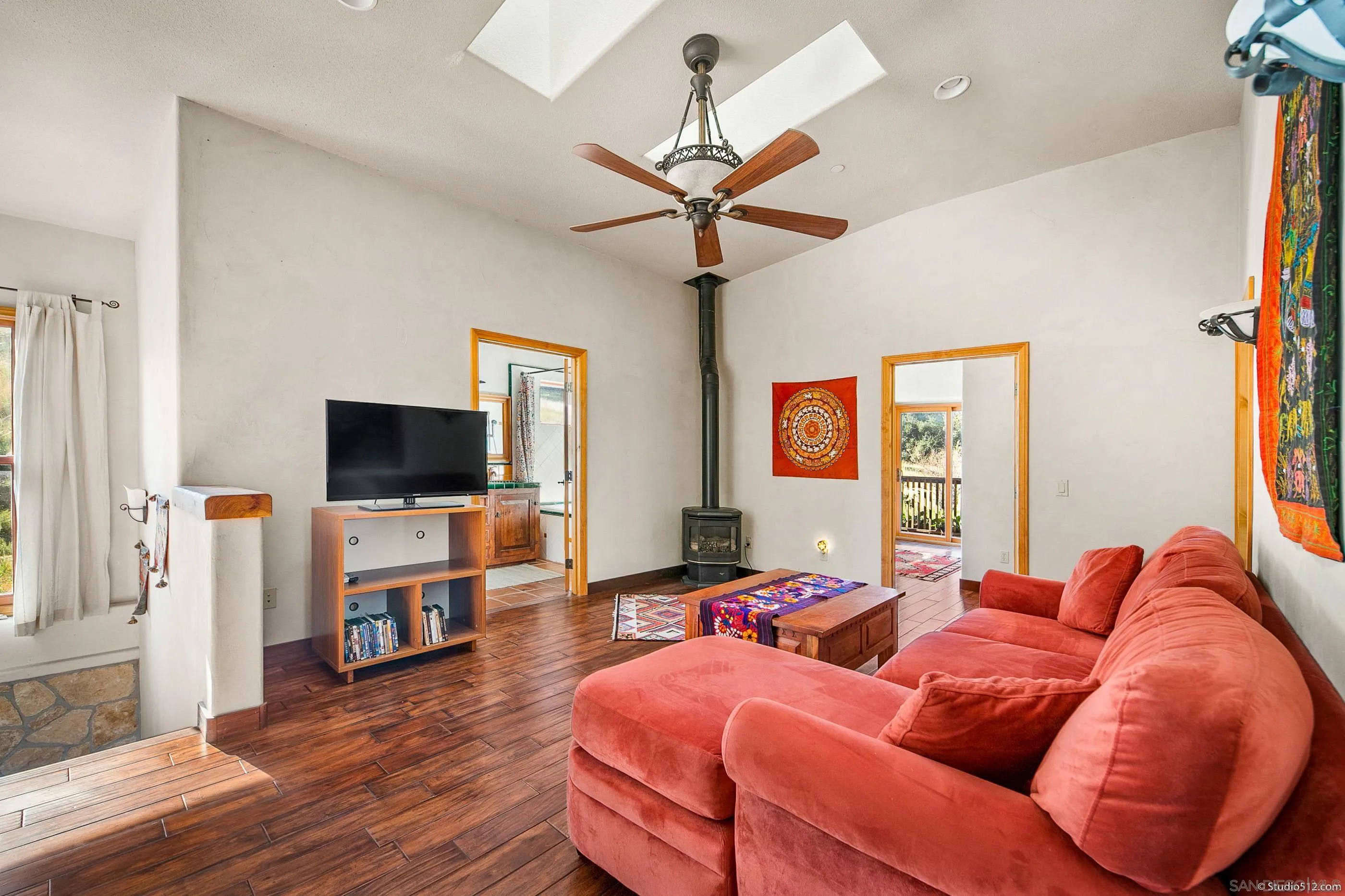 1861 Wynola Road Julian, CA 92036 - Photo 31 of 75 a living room with furniture and a flat screen tv