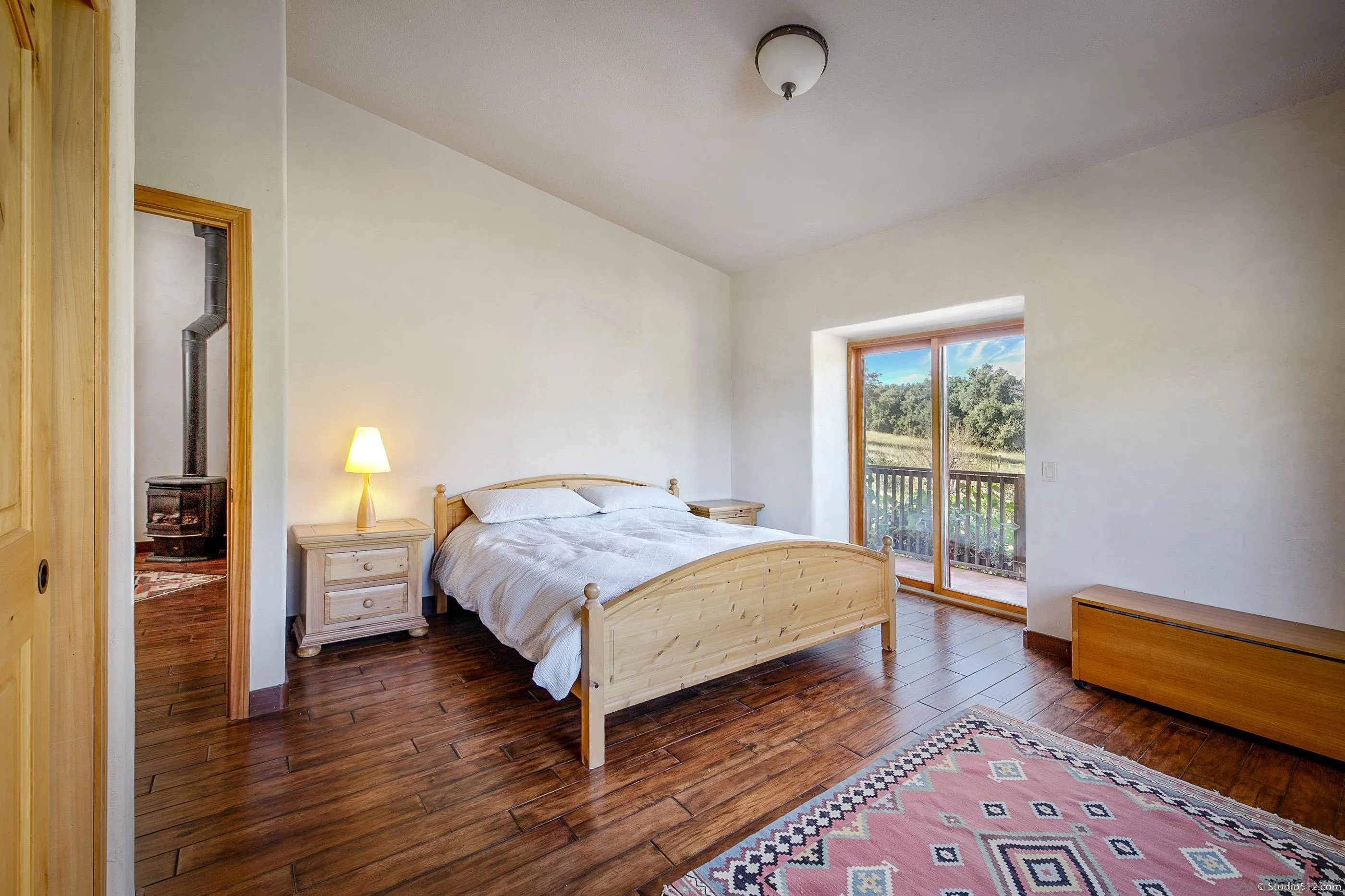 1861 Wynola Road Julian, CA 92036 - Photo 34 of 75 a bedroom with a bed and wooden floor