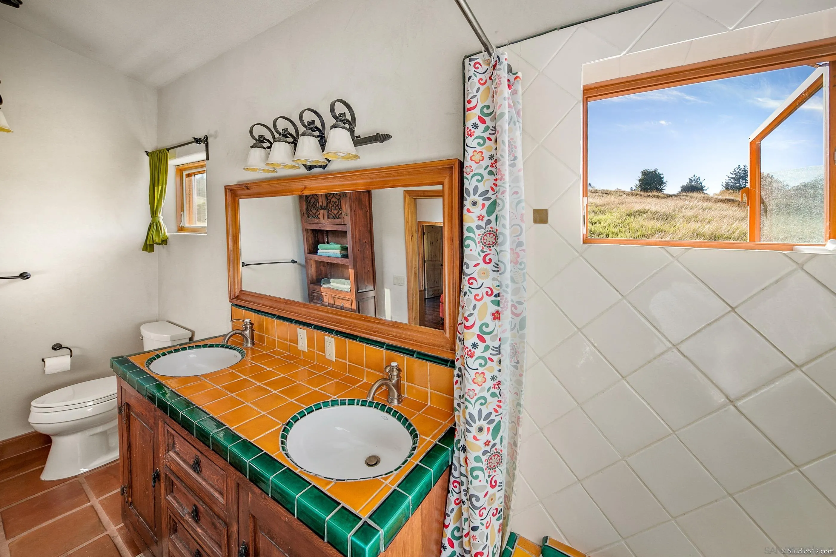 1861 Wynola Road Julian, CA 92036 - Photo 38 of 75 a bathroom with a sink mirror vanity and toilet