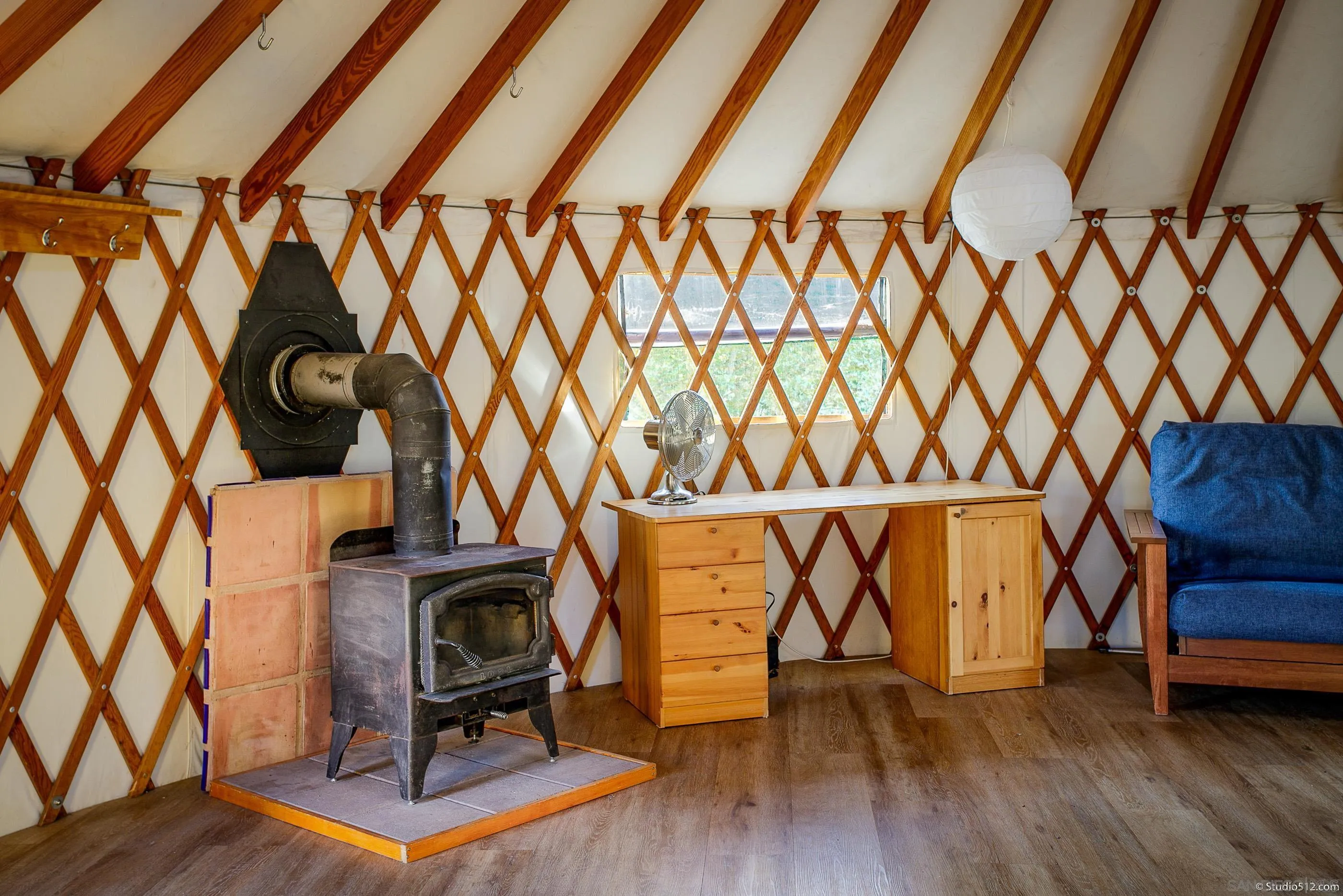 1861 Wynola Road Julian, CA 92036 - Photo 59 of 75 a view of an empty room with wooden floor and a window