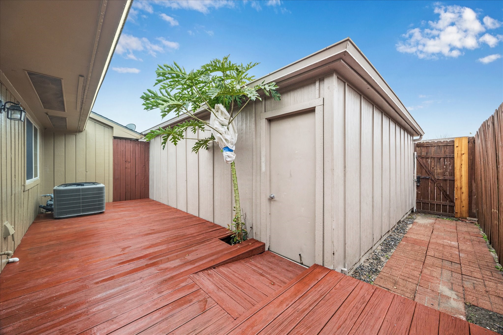 11433 Sabo Road Houston, TX 77089 - Photo 17 of 19 Inviting and relaxing outdoor patio with wooden deck.