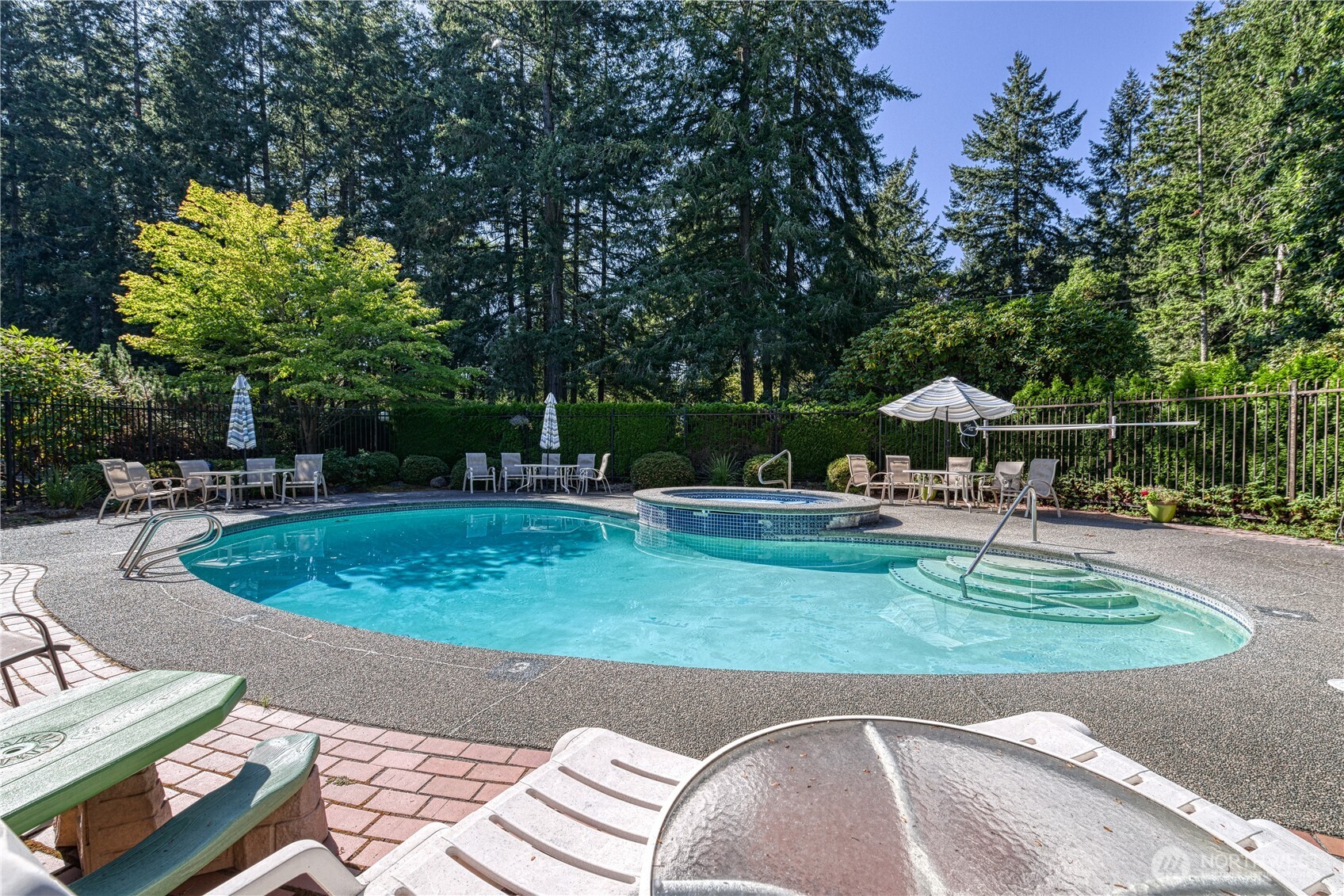 a view of a swimming pool with a patio