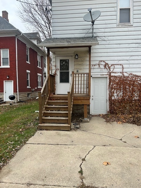 518 College Avenue, Unit 2 DeKalb, IL 60115 - Photo 13 of 13 a view of a brick house with many windows