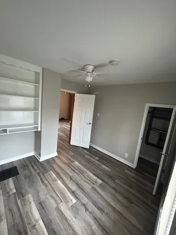 a view of an empty room and a window