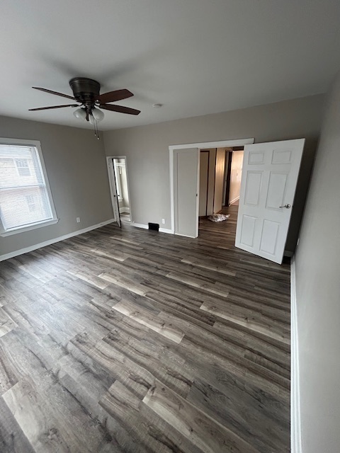 518 College Avenue, Unit 2 DeKalb, IL 60115 - Photo 3 of 13 a view of a livingroom with a ceiling fan and window