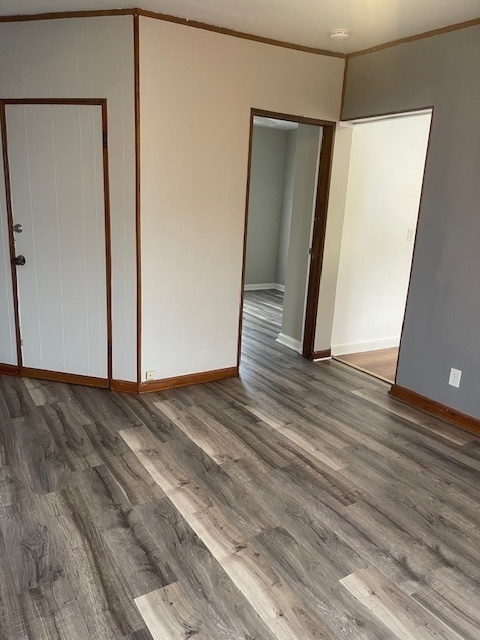 518 College Avenue, Unit 2 DeKalb, IL 60115 - Photo 4 of 13 a view of a room with wooden floor