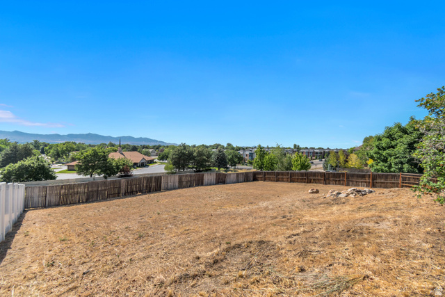 9832 Falconhurst Drive Sandy, UT 84092 - Photo 28 of 29 Expansive, level backyard offering a large open area