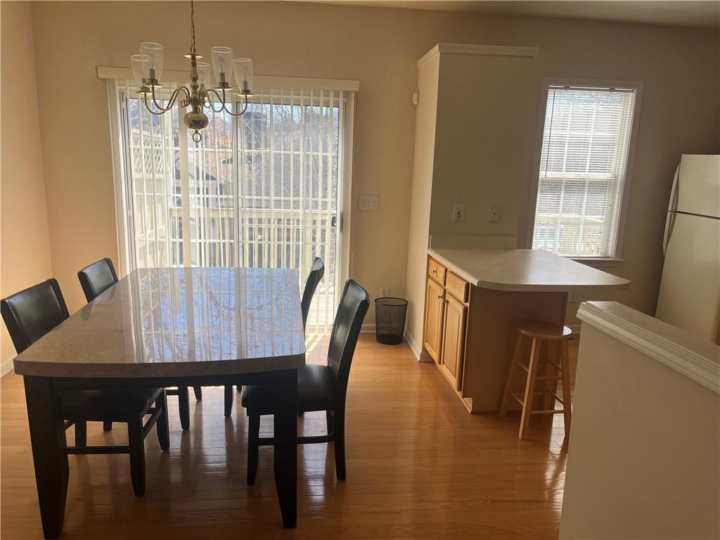 3908 Howell Park Road Duluth, GA 30096 - Photo 1 of 1 a view of a dining room with furniture and window