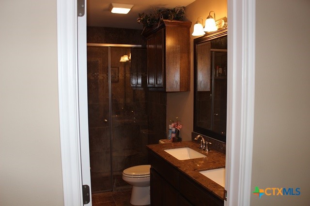 3009 Lenora Drive Victoria, TX 77901 - Photo 12 of 25 a bathroom with a sink and a mirror