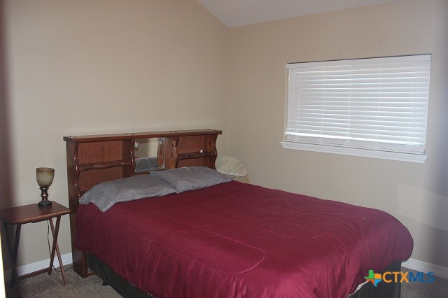 3009 Lenora Drive Victoria, TX 77901 - Photo 18 of 25 a bedroom with a bed and a window