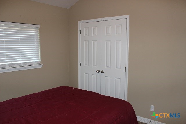 3009 Lenora Drive Victoria, TX 77901 - Photo 19 of 25 a bedroom with a bed and a window