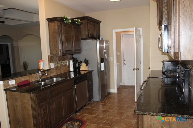 3009 Lenora Drive Victoria, TX 77901 - Photo 6 of 25 a kitchen with a refrigerator stove and sink