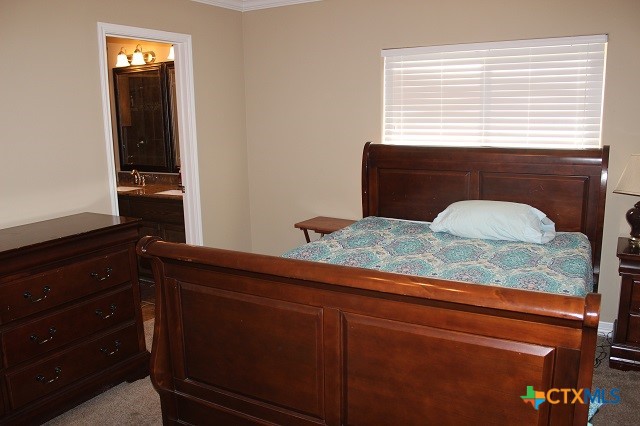 3009 Lenora Drive Victoria, TX 77901 - Photo 10 of 25 a bathroom with a granite countertop sink and vanity