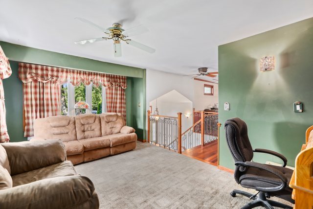 1S225 Valley Road Lombard, IL 60148 - Photo 2 of 46 a living room with furniture a chandelier and a large window