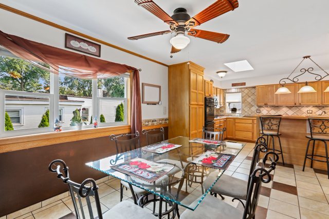 1S225 Valley Road Lombard, IL 60148 - Photo 11 of 46 a view of a dining room with furniture window and outside view