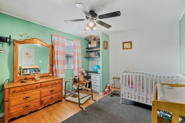 1S225 Valley Road Lombard, IL 60148 - Photo 15 of 46 a bedroom with furniture and a large window