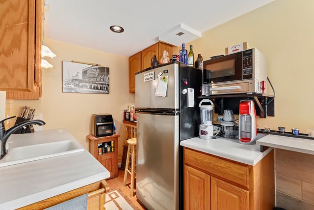 1S225 Valley Road Lombard, IL 60148 - Photo 23 of 46 a kitchen with stainless steel appliances granite countertop a refrigerator and a sink