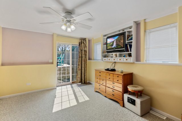 1S225 Valley Road Lombard, IL 60148 - Photo 24 of 46 a living room with furniture and a flat screen tv