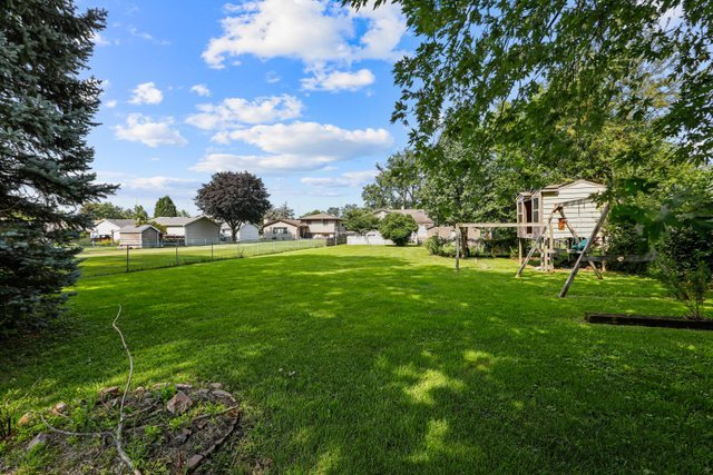 1S225 Valley Road Lombard, IL 60148 - Photo 39 of 46 a backyard of a house with table and chairs