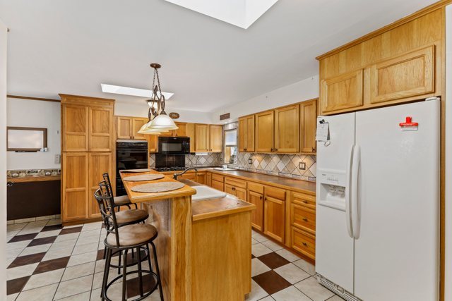 1S225 Valley Road Lombard, IL 60148 - Photo 8 of 46 a kitchen with stainless steel appliances a stove a refrigerator and a refrigerator