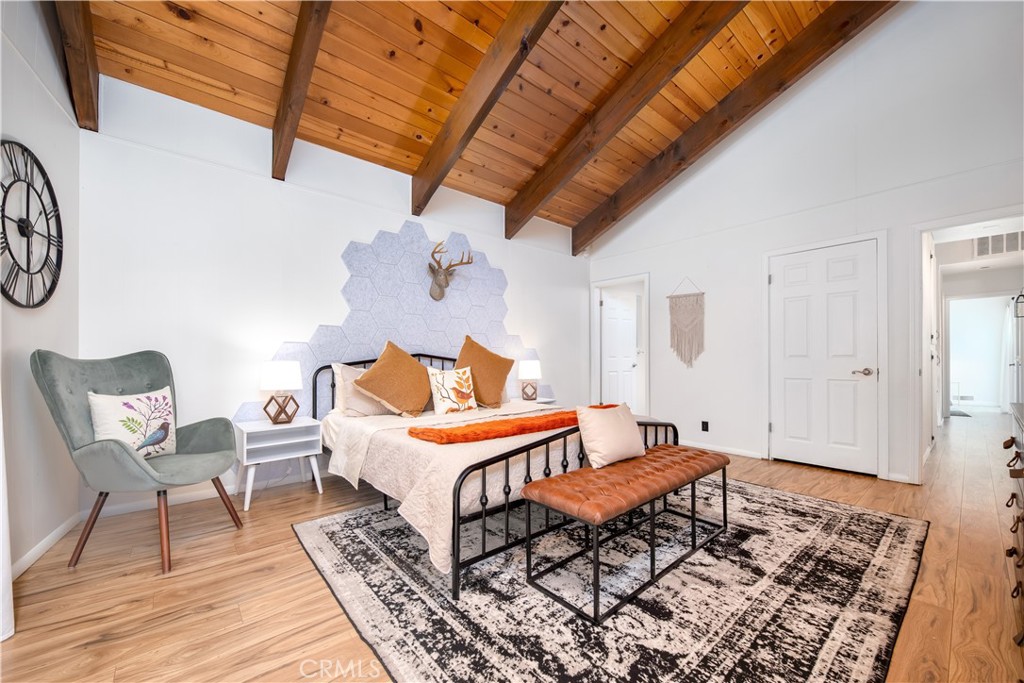 39651 Flicker Road Fawnskin, CA 92333 - Photo 17 of 58 a bedroom with furniture and wooden floor