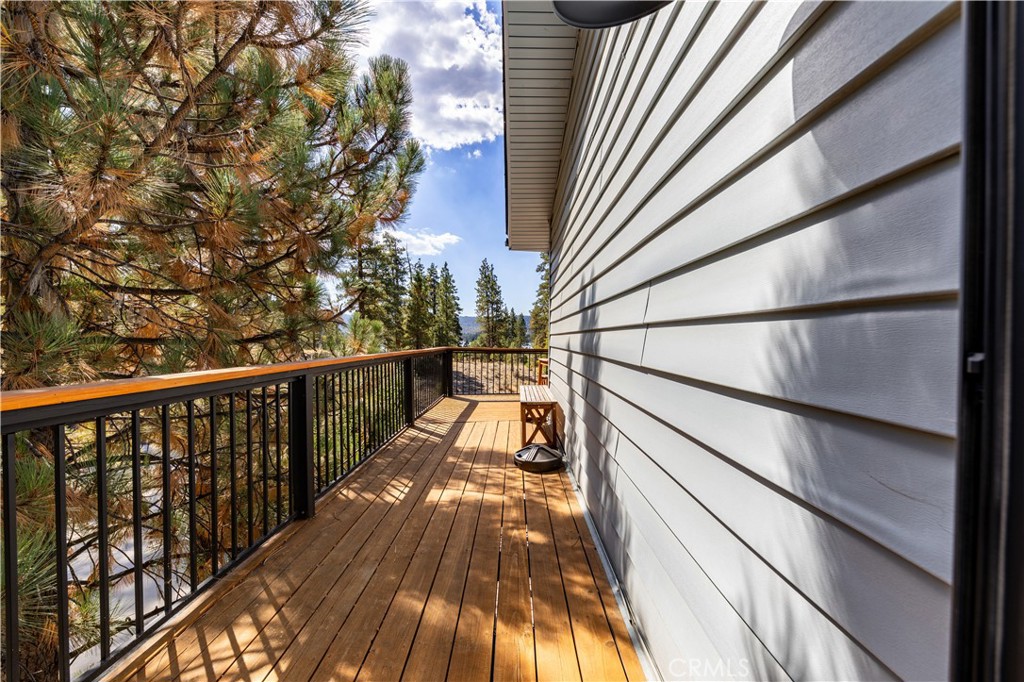 39651 Flicker Road Fawnskin, CA 92333 - Photo 25 of 58 a view of balcony with wooden floor and outdoor seating