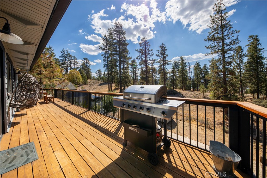 39651 Flicker Road Fawnskin, CA 92333 - Photo 28 of 58 a view of balcony with wooden floor and outdoor seating