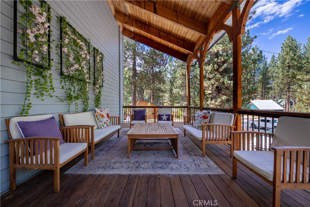 39651 Flicker Road Fawnskin, CA 92333 - Photo 3 of 58 a sitting area with furniture on wooden floor