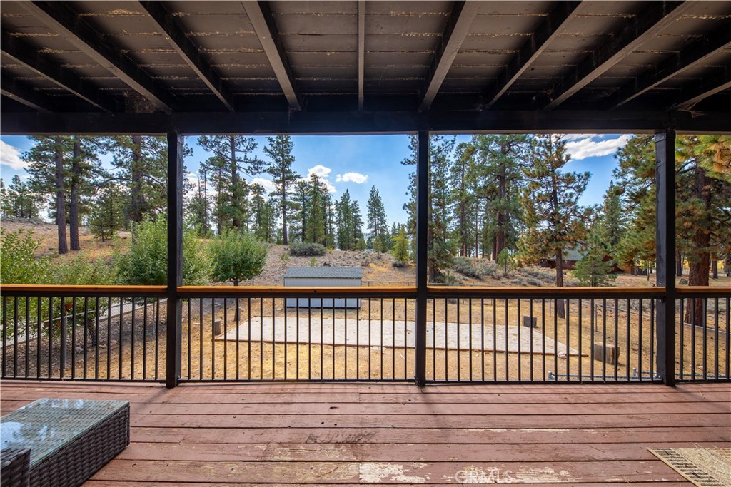 39651 Flicker Road Fawnskin, CA 92333 - Photo 41 of 58 a view of a balcony with wooden floor