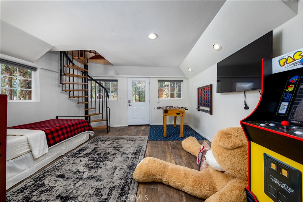 39651 Flicker Road Fawnskin, CA 92333 - Photo 45 of 58 a living room with furniture and a flat screen tv