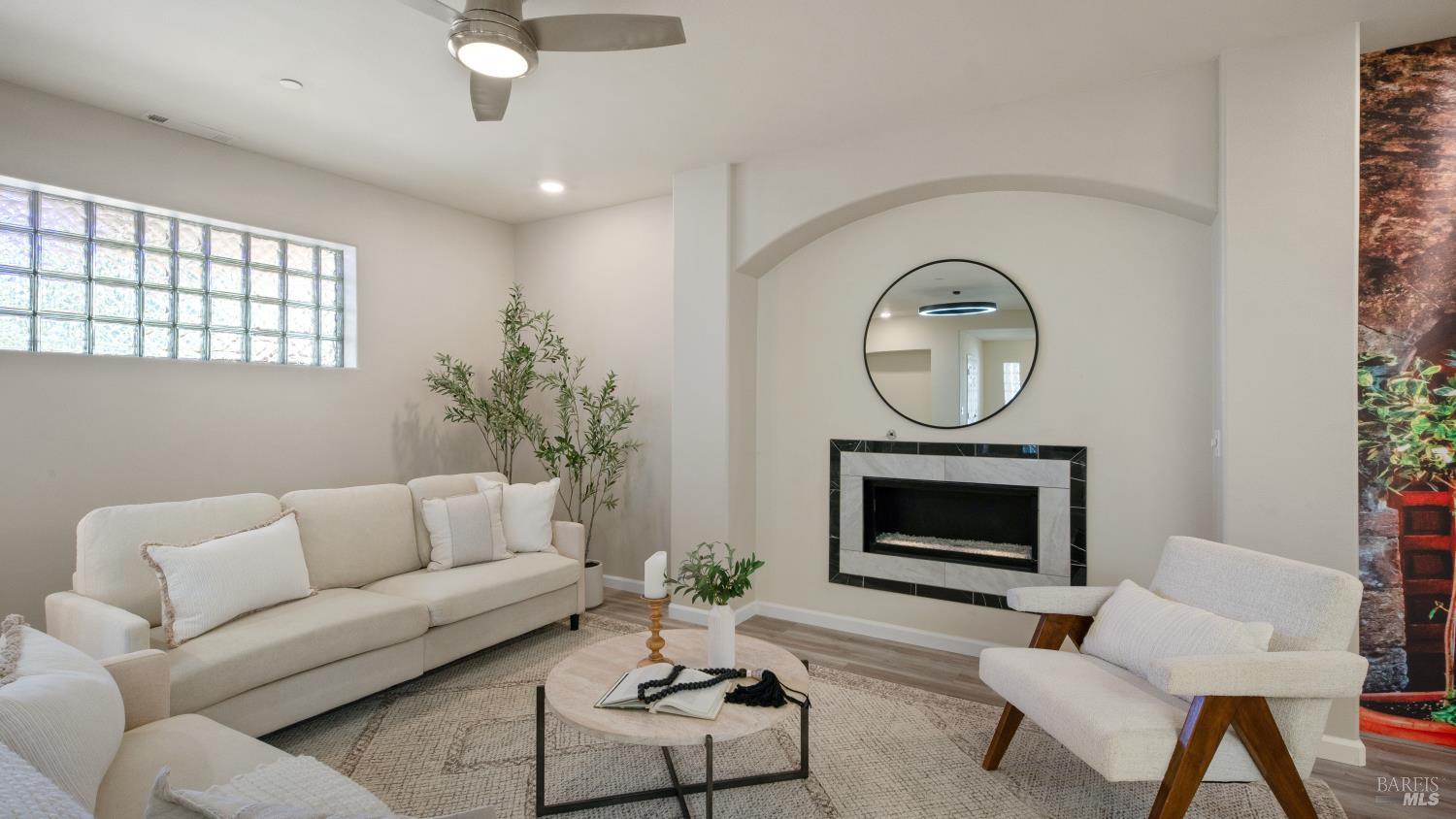 17867 Deer Hill Road Hidden Valley Lake, CA 95467 - Photo 17 of 53 a living room with furniture a fireplace and a potted plant