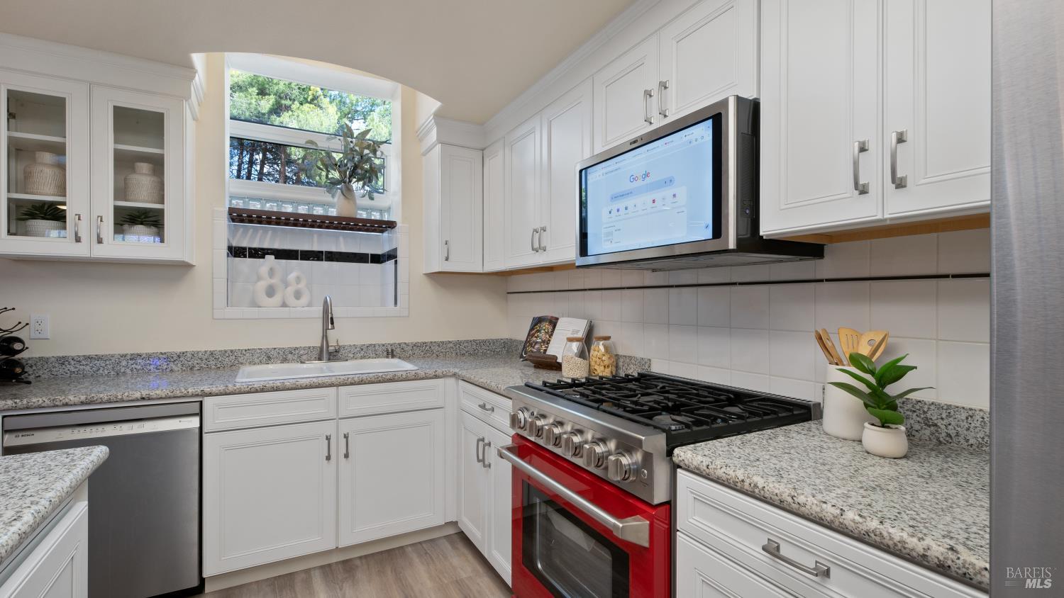 17867 Deer Hill Road Hidden Valley Lake, CA 95467 - Photo 20 of 53 a kitchen with stainless steel appliances granite countertop white cabinets and a stove