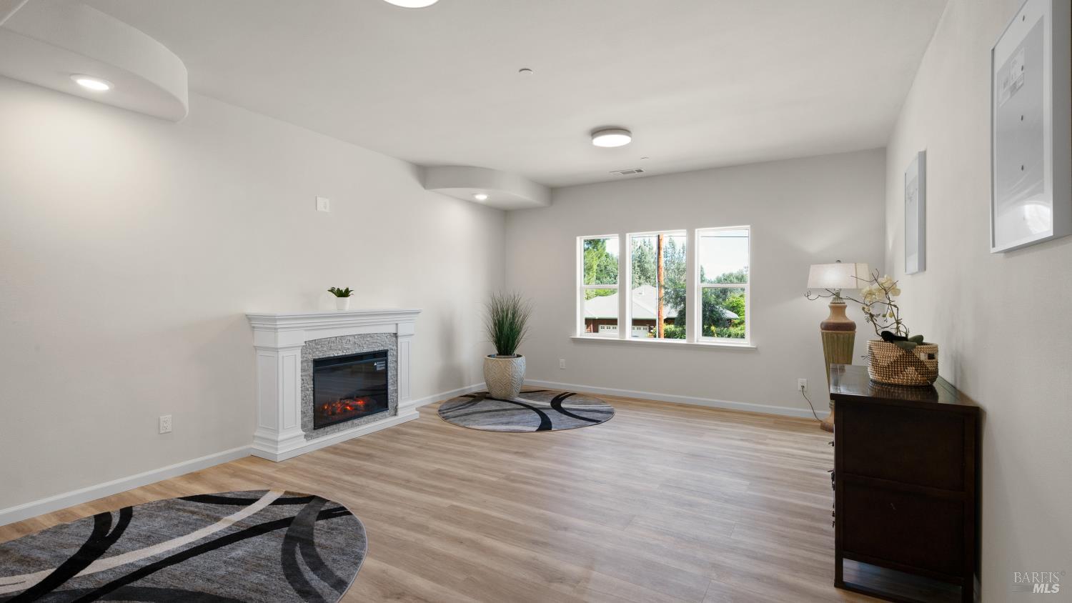 17867 Deer Hill Road Hidden Valley Lake, CA 95467 - Photo 25 of 53 a living room with furniture window and a fireplace