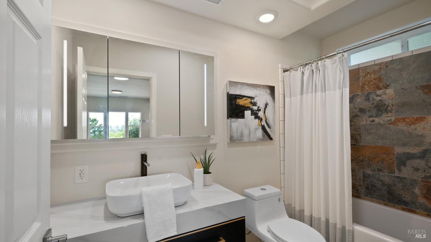 17867 Deer Hill Road Hidden Valley Lake, CA 95467 - Photo 28 of 53 a bathroom with a sink toilet and shower