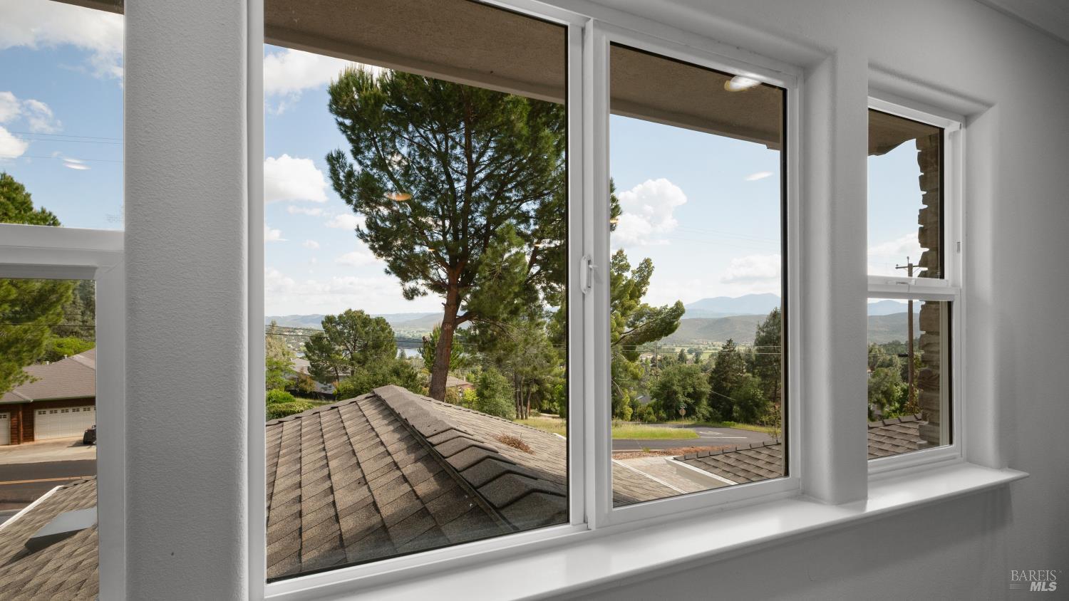 17867 Deer Hill Road Hidden Valley Lake, CA 95467 - Photo 39 of 53 a view of a glass door and a window