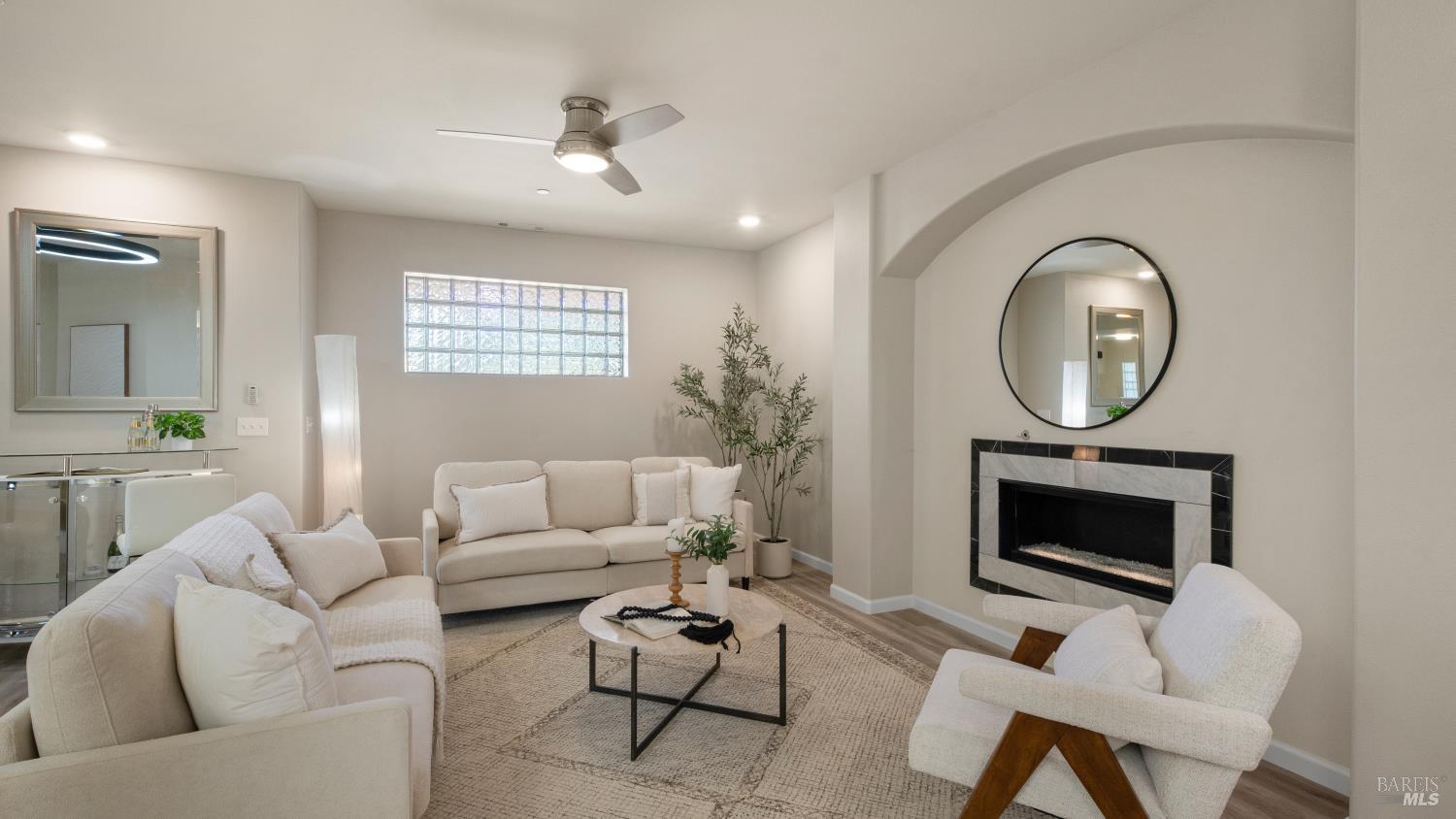 17867 Deer Hill Road Hidden Valley Lake, CA 95467 - Photo 4 of 53 a living room with furniture a fireplace and a flat screen tv