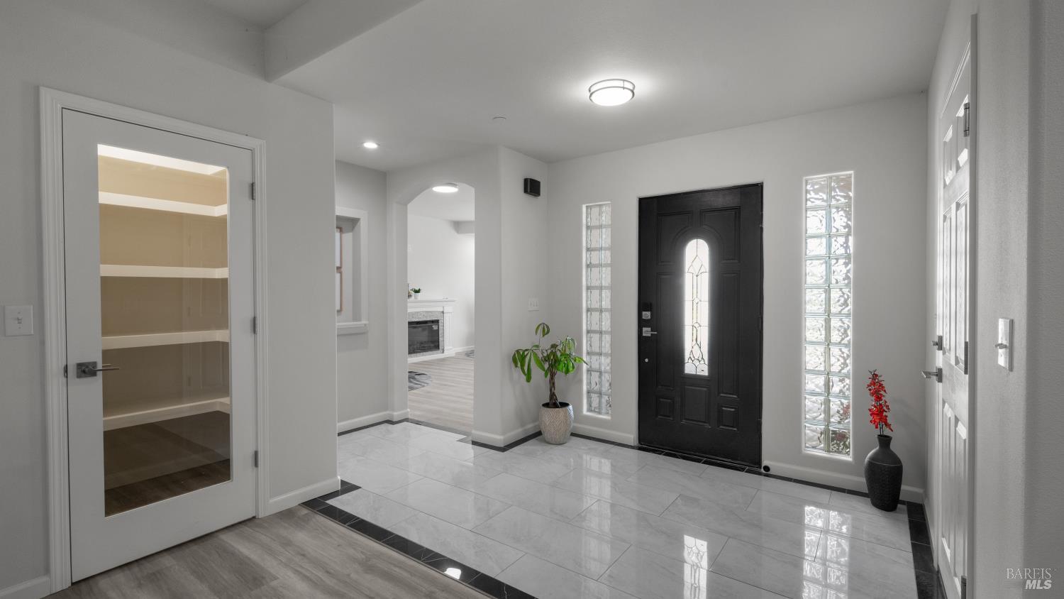17867 Deer Hill Road Hidden Valley Lake, CA 95467 - Photo 9 of 53 a view of a hallway with bathroom and wooden floor