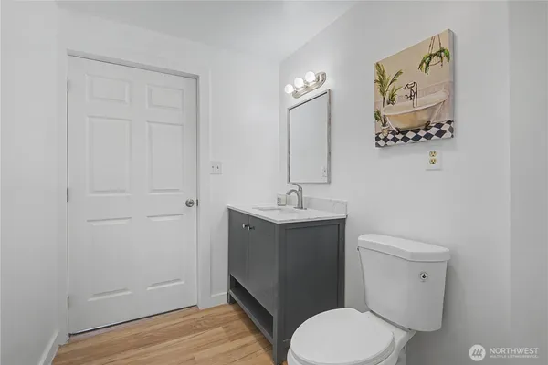 a bathroom with a sink a mirror and a window