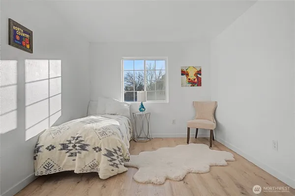a bed room with a bed and a window