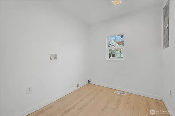 a view of an entryway with wooden floor